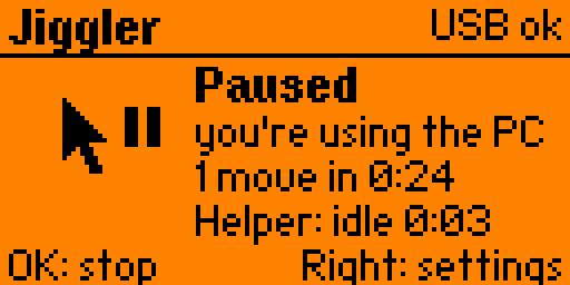 Jiggler paused: the pointer with a pause sign beside it, then "Paused", "you're using the PC", "1 move in 0:24" and "Helper: idle 0:03".