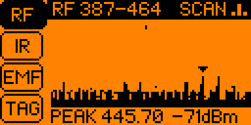Tricorder's RF tab on the Flipper's orange screen: tabs for RF, IR, EMF and TAG down the left with RF highlighted. A filled bar across the top reads "RF 387-464" and "SCAN", a spectrum of spikes fills the middle with a marker over the tallest, and the bottom line reads "PEAK 445.70 -71dBm".